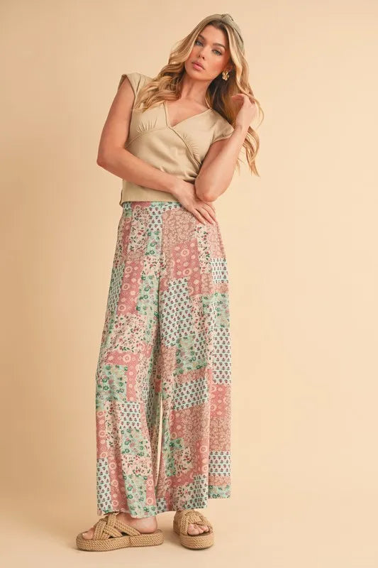 Printed wide-leg pants, mint/pink patchwork floral design on loose silhouette