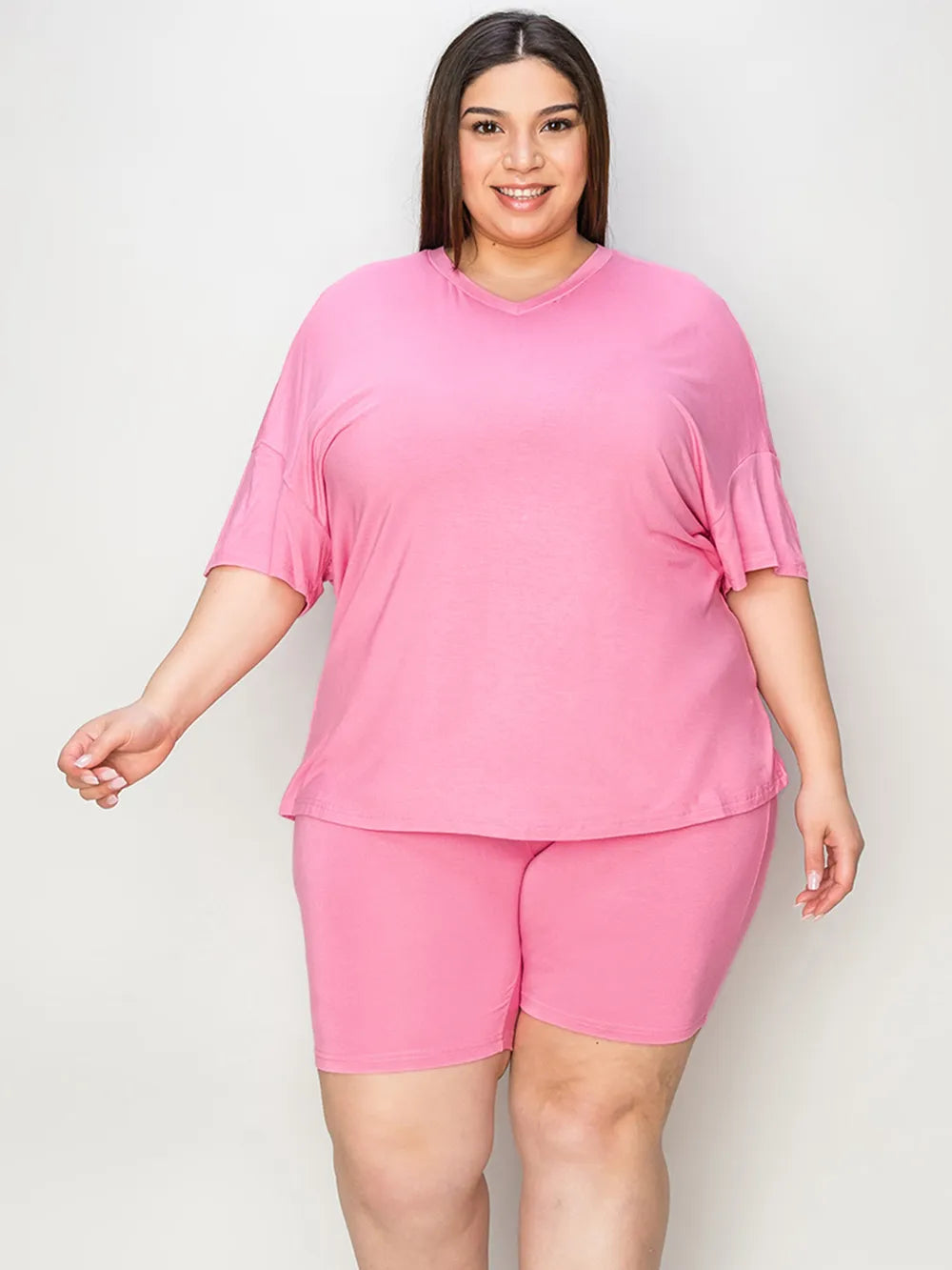 Pink V-neck drop-shoulder T-shirt and matching shorts set, relaxed front