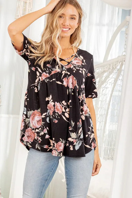 Black floral babydoll top with crisscross neckline and short sleeves