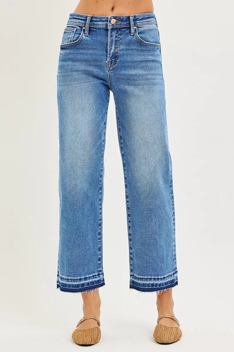 Medium-wash wide-leg boyfriend jeans with cropped length and frayed hem cuffs