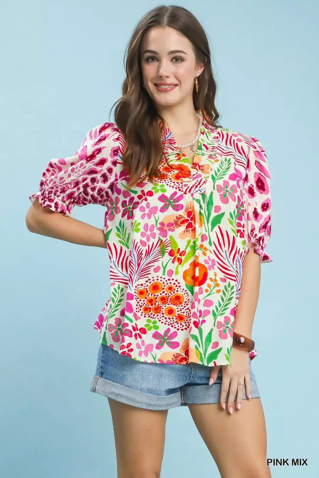 V-neck ruffle-trim puff-sleeve top in pink, green, and orange floral print
