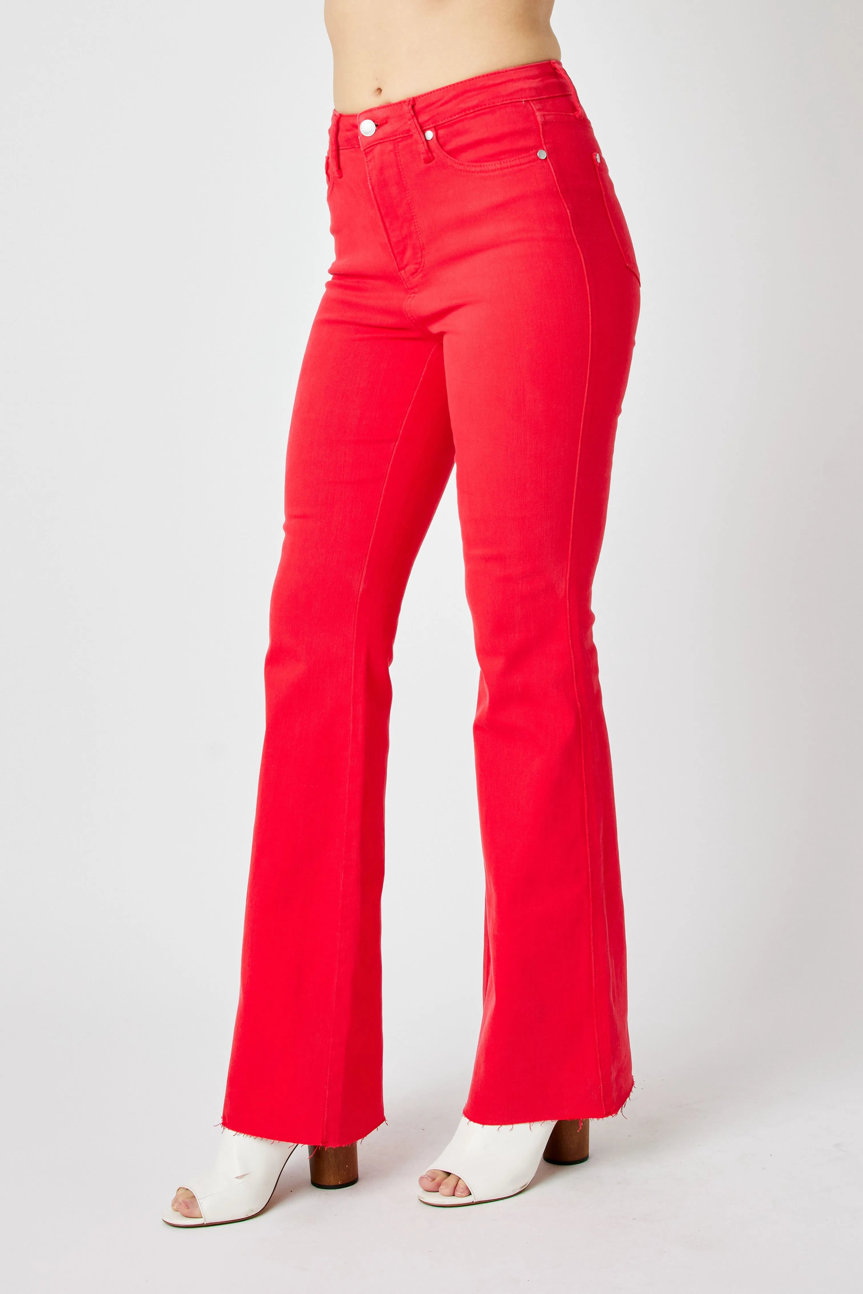 Red high-rise flare jeans, back view with yoke stitching and rear pockets
