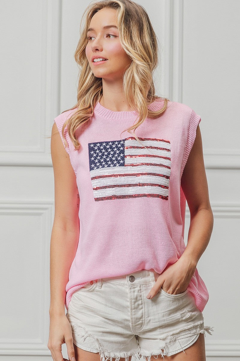 Pink knit sleeveless top with sequin American flag patch on the chest