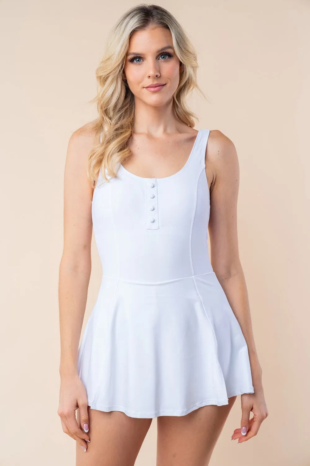 Off-white performance swim dress front view with scoop neck and small button placket