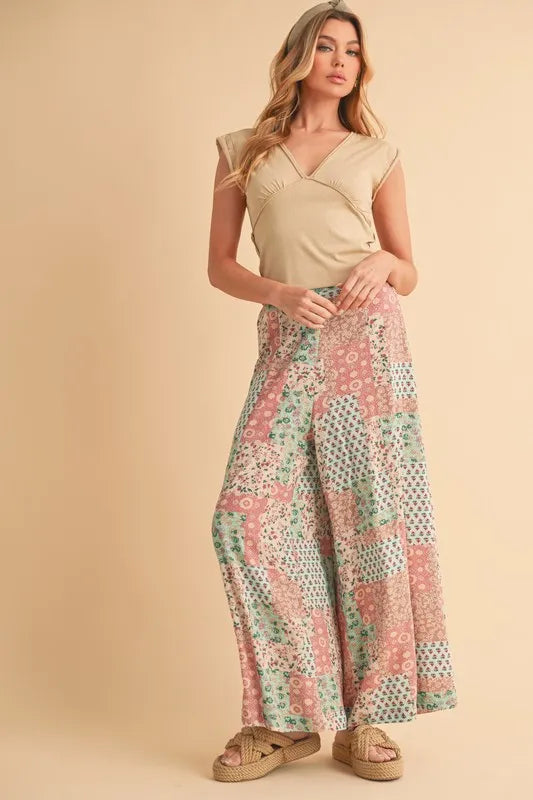 Mint/pink patchwork printed wide-leg pants with tiered-looking block panels