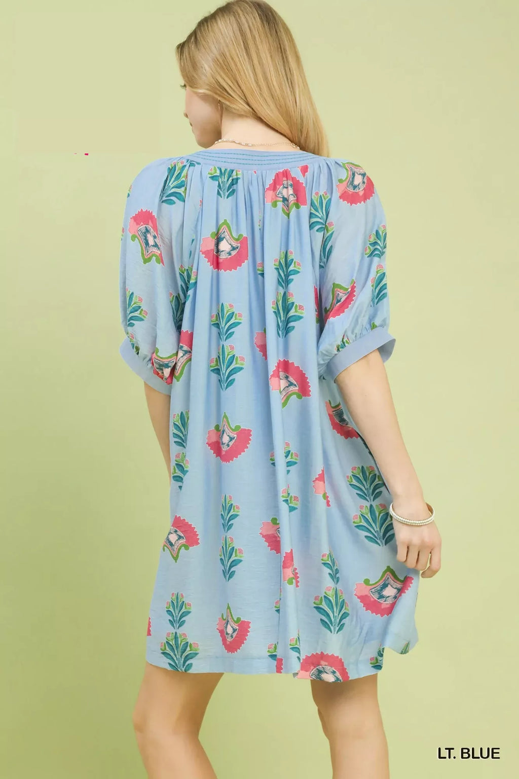 Back view: light blue mini dress with bird and leaf print