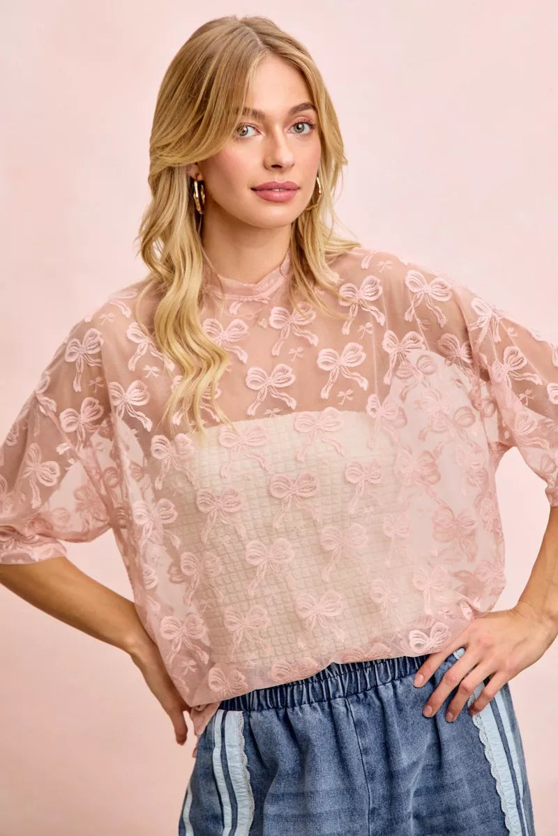 Dusty rose bow-pattern mesh blouse with short sleeves and boxy silhouette