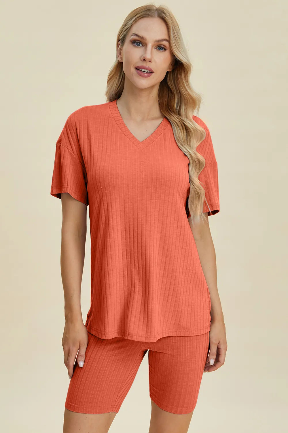 Coral ribbed V-neck short sleeve top and matching biker shorts set, front view