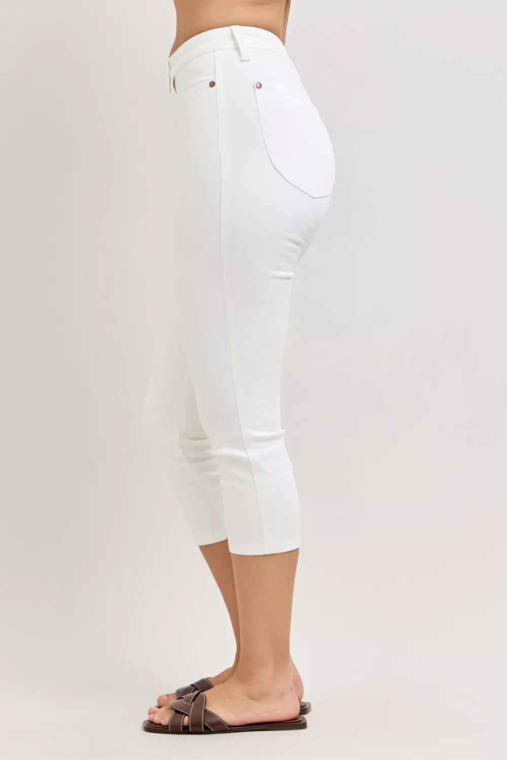 White high-waist capri jeans, back view, spade pocket styling