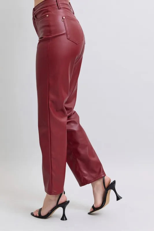 Red high-waist faux leather straight pants, side view with back pocket detail