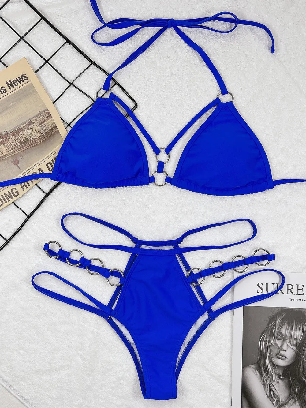 Royal blue bikini set: halter triangle top with cutout straps and matching high-rise thong bottoms
