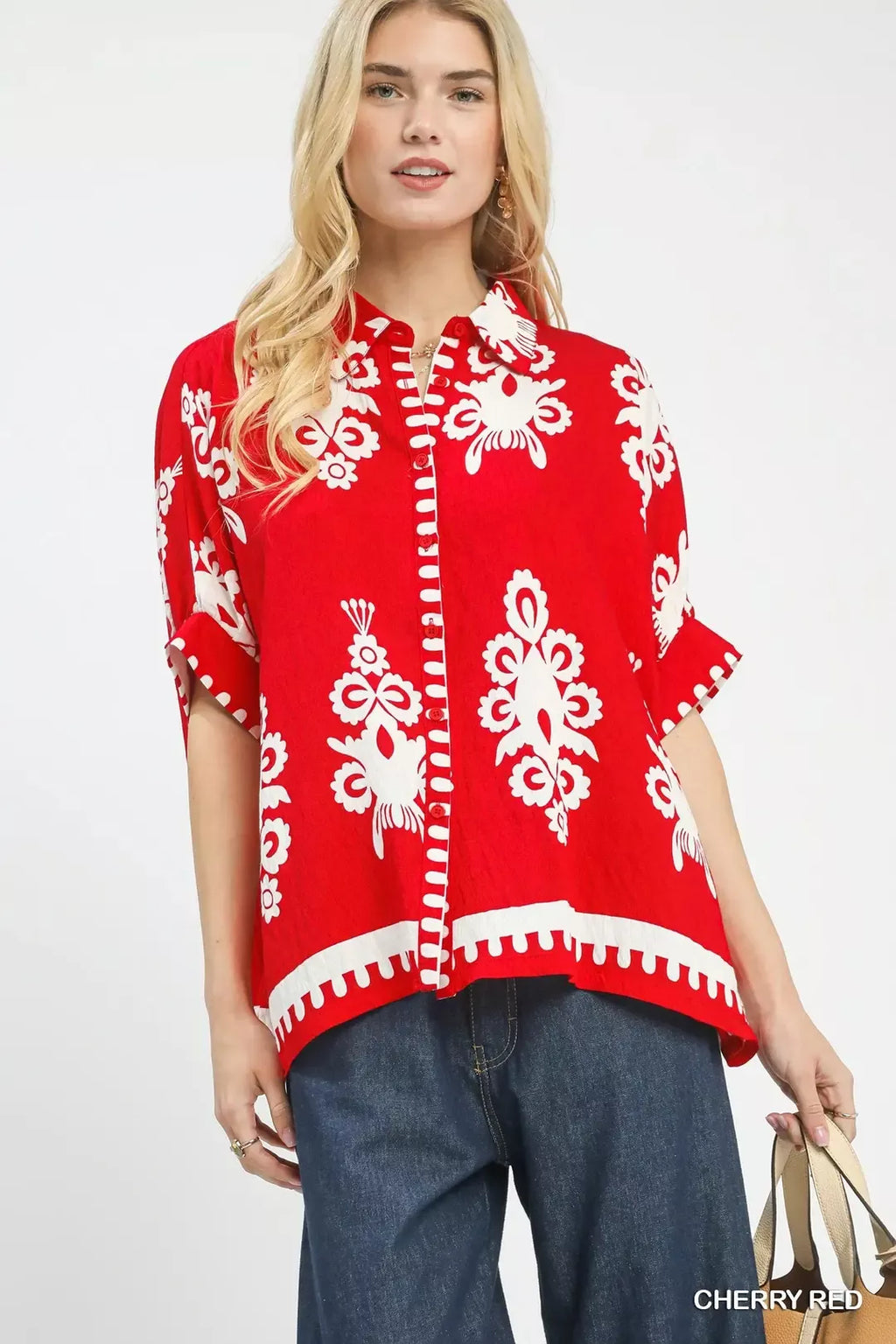 Cherry red short-sleeve button-down shirt with white floral abstract print