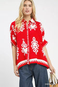 Cherry red short-sleeve button-down shirt with white floral abstract print