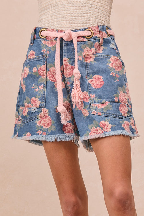 Blue denim floral shorts with braided waist belt, patch pockets, frayed hem