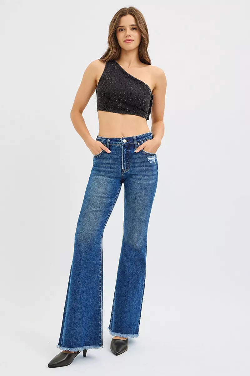 High-rise flare jeans in dark wash denim with frayed cuffs and distressed knee patches.