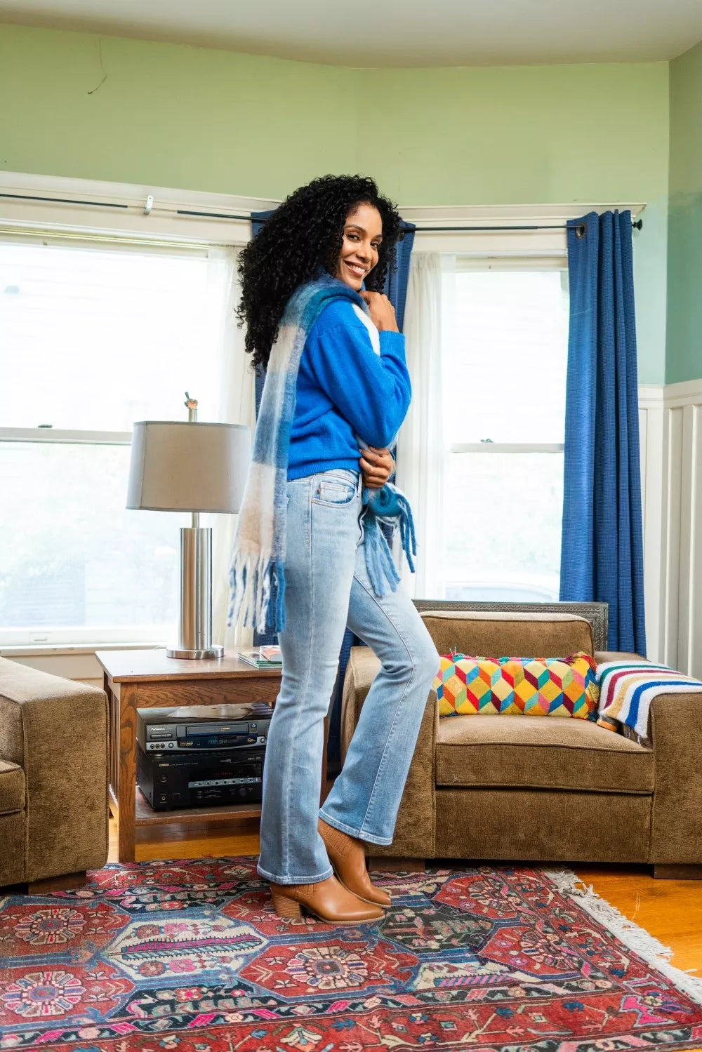 Light wash bootcut jeans with mid-rise fit and belt loops