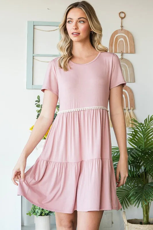 Dusty rose short-sleeve tiered mini dress with pompom lace trim at the empire seam