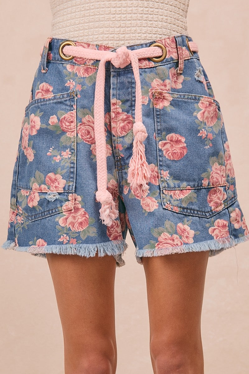 Floral print denim shorts with braided tie waist and tassels, patch pockets