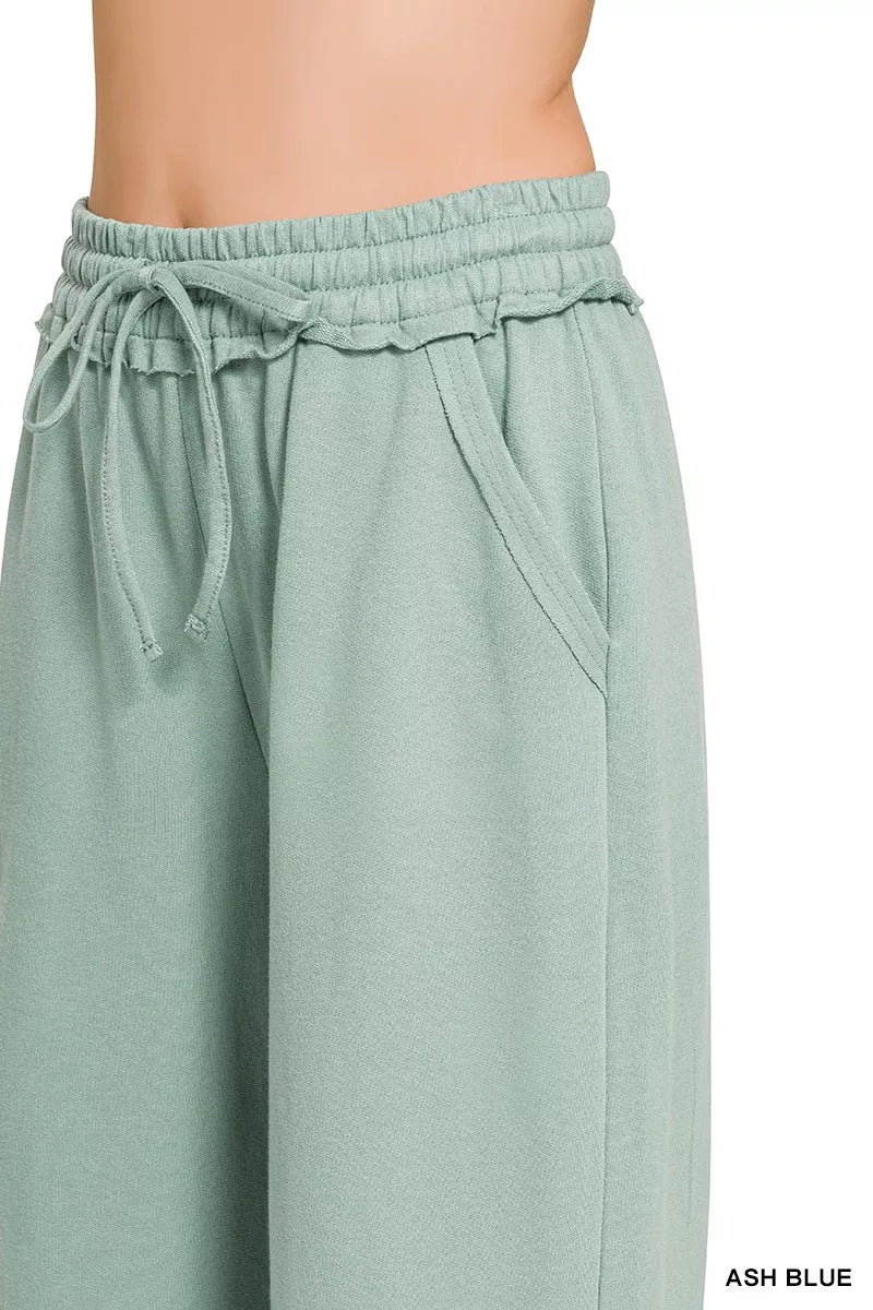 Ash blue wide-leg joggers with elastic waist and tie drawstring, front view