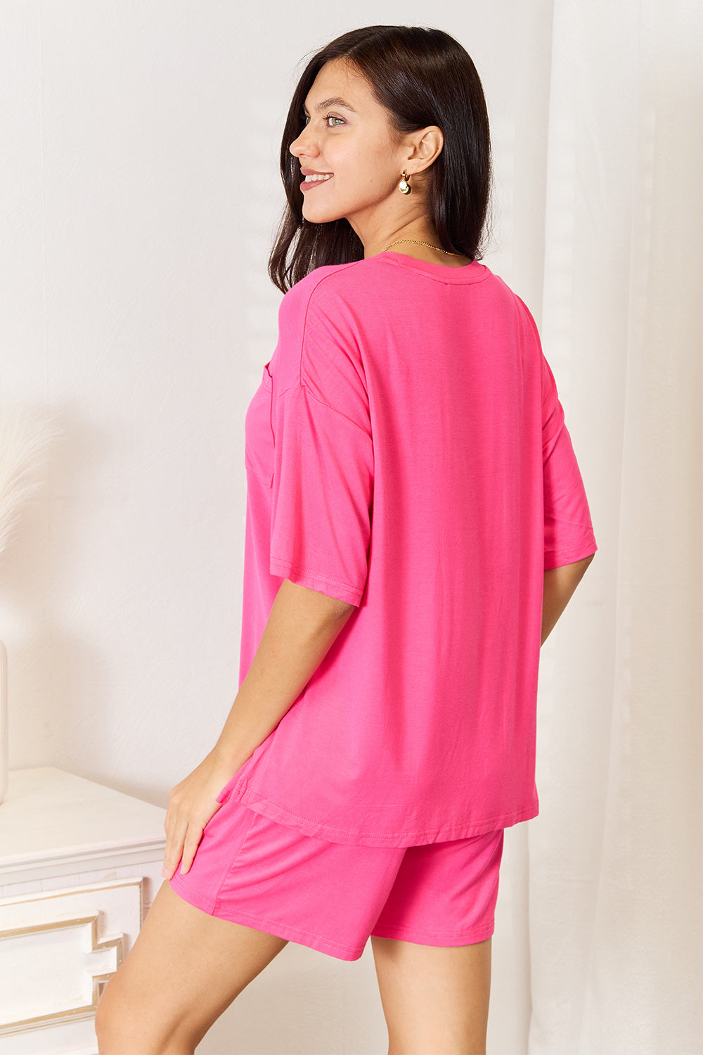 Hot pink rayon top and shorts set, back view with half-sleeve crewneck and matching shorts