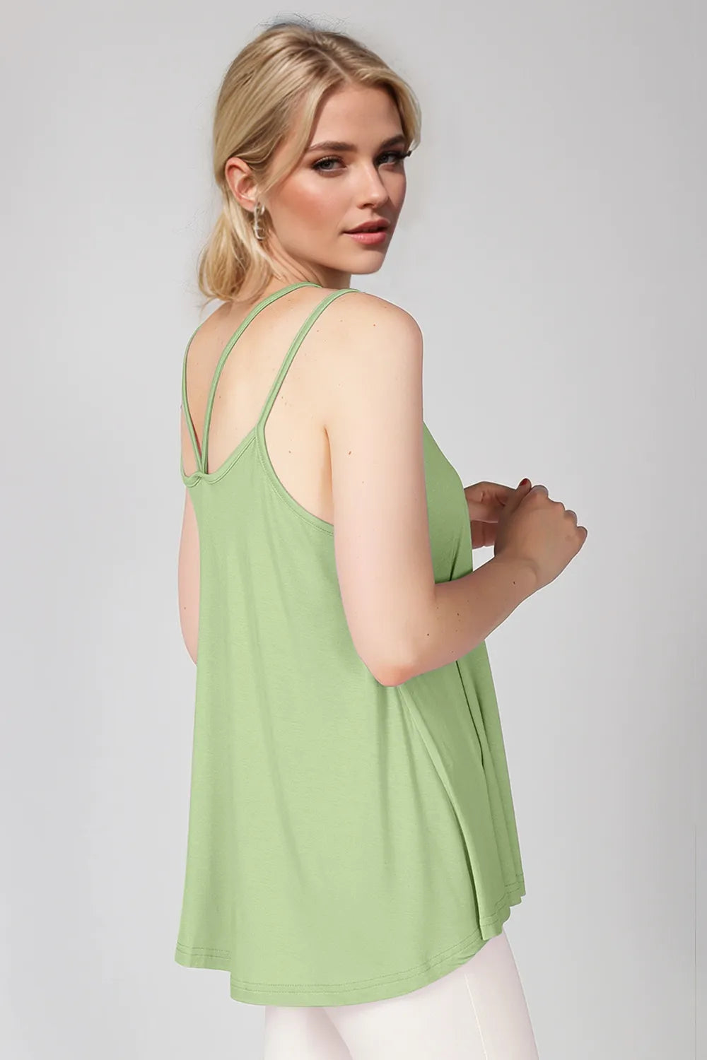 Green cami with scoop neck and double spaghetti straps, open back racerback.