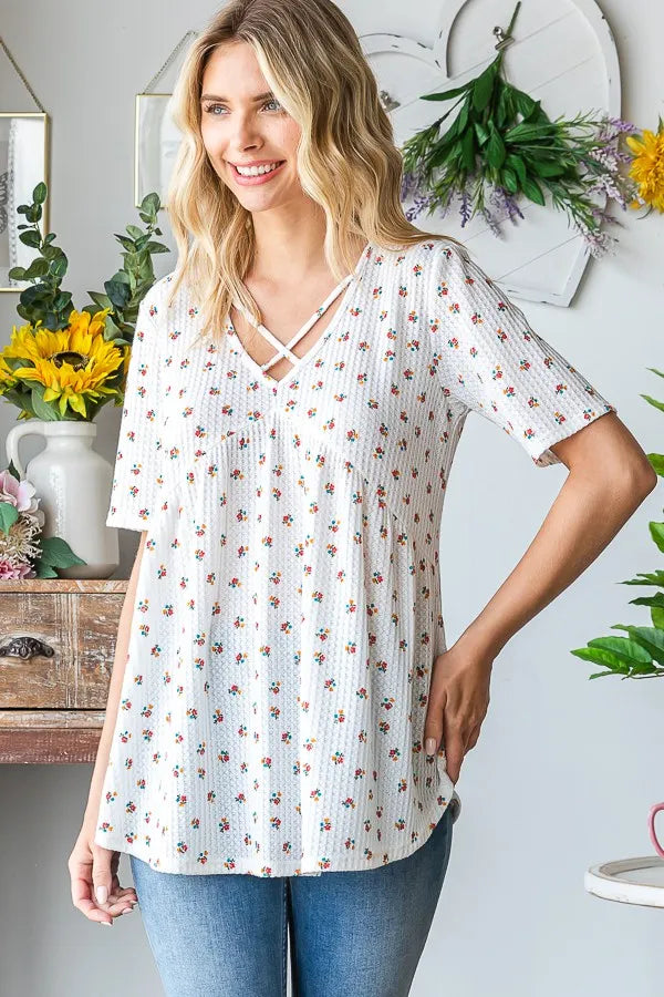 Ditsy floral babydoll top, white base, soft pleats and crisscross V neckline