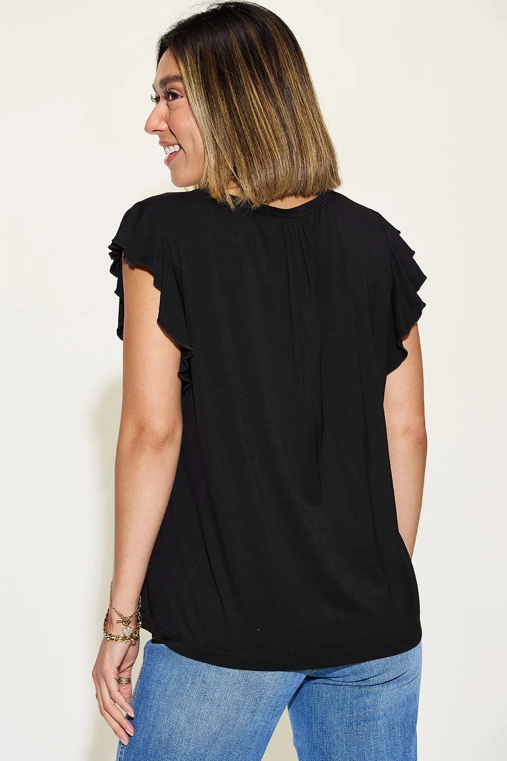 Black short-sleeve V-neck T-shirt with ruffled shoulder sleeves