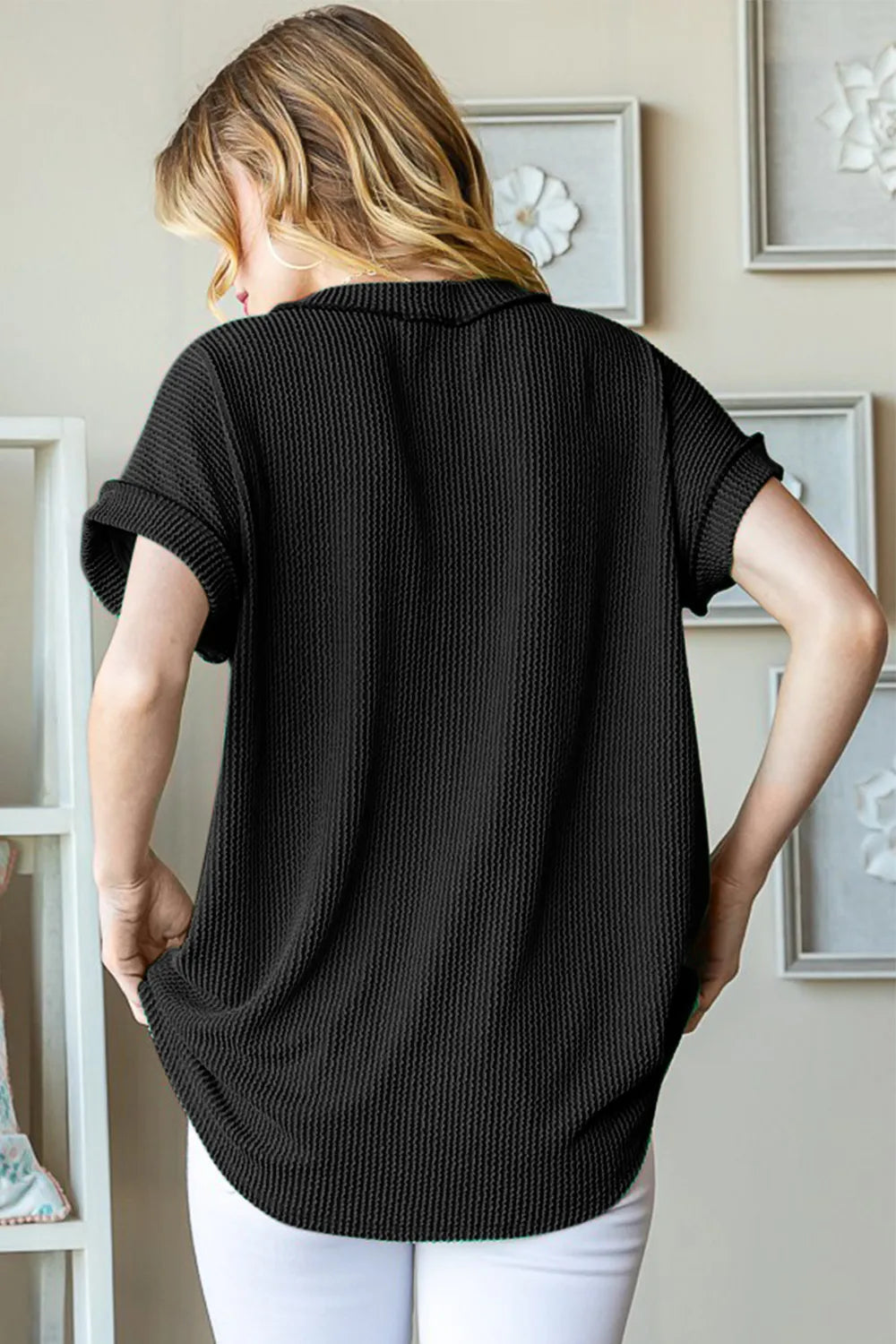 Black ribbed V-neck short-sleeve top, back view