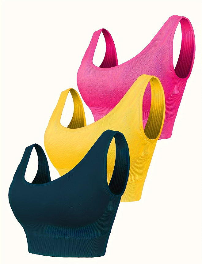 Seamless sports bra set, pink and yellow and dark teal bras with racerback straps