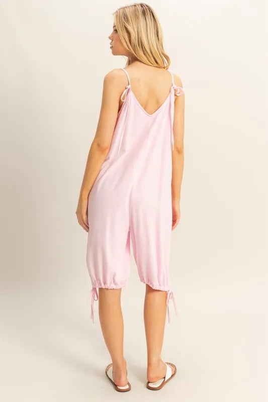 Back view: L.PINK V-neck romper with tied shoulder straps and side-tie hems