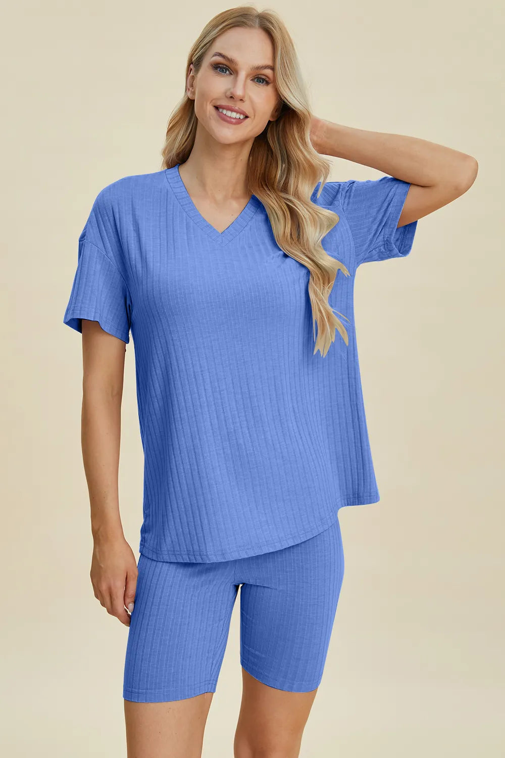 Blue ribbed V-neck short-sleeve top and biker shorts set, angled front view