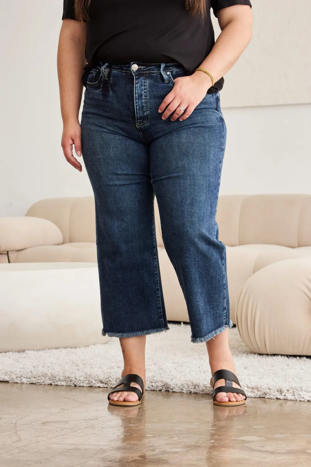 Curvy high-waist denim jeans with button fly and raw hem, dark blue wash