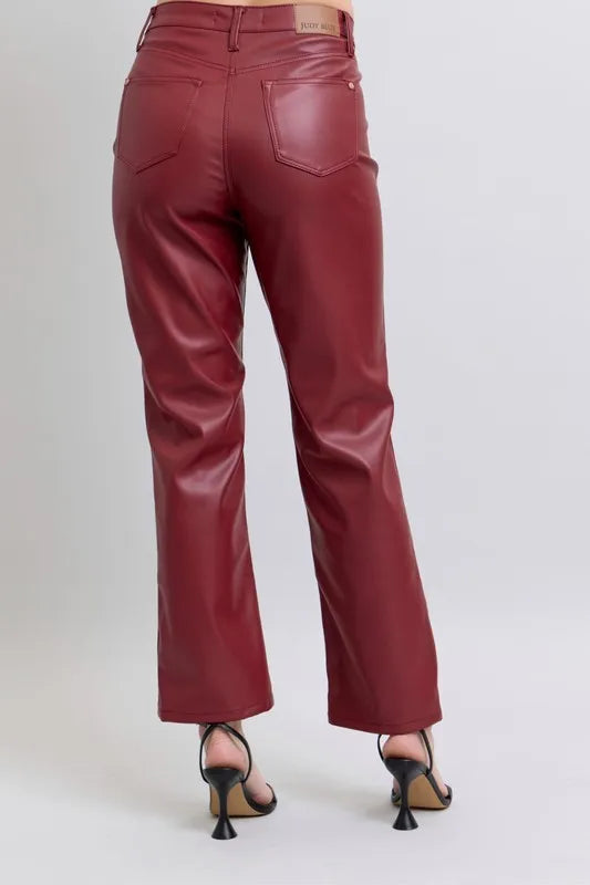 Red high-waist faux leather straight pants with front crease and two front pockets