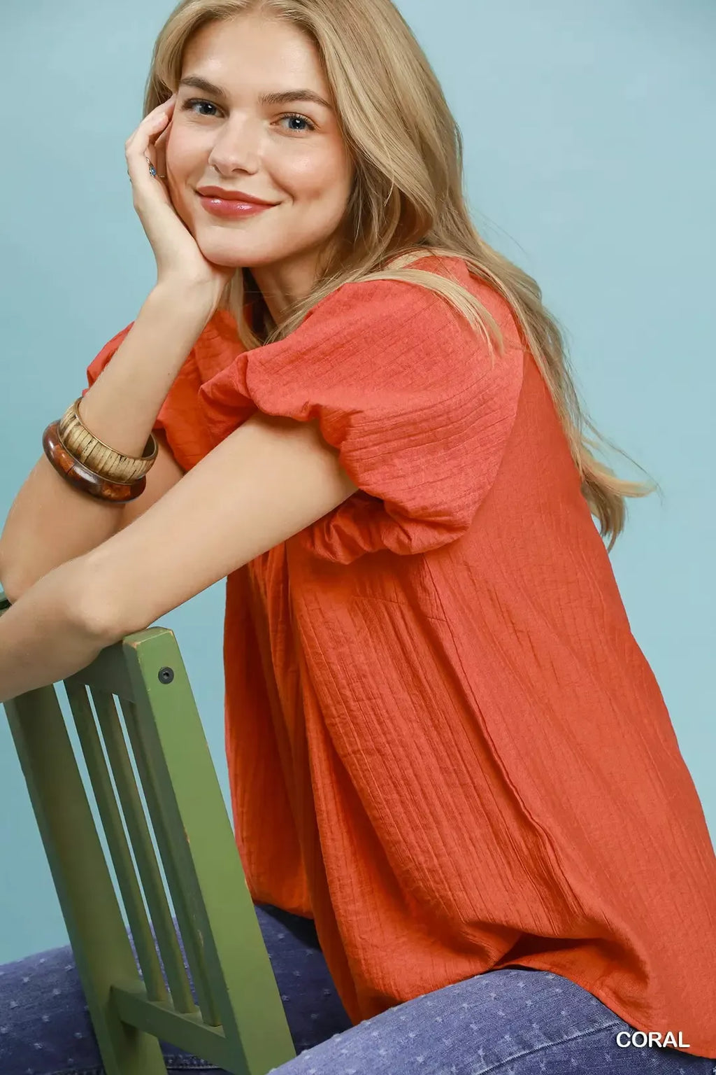 Coral gathered V-neck top with short puff sleeves