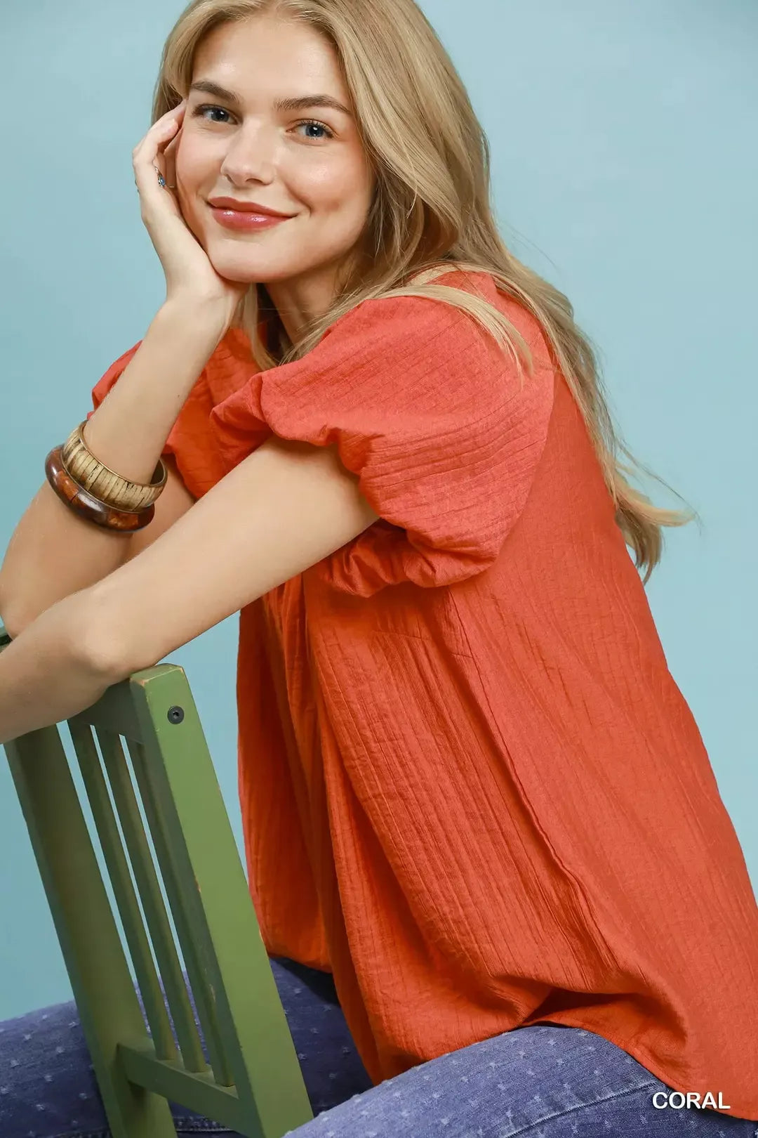 Coral gathered V-neck top with short puff sleeves