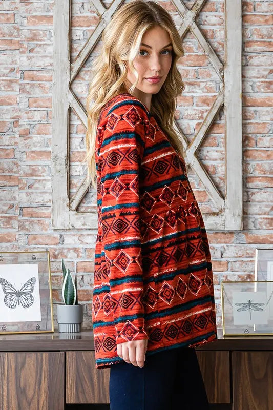 Long-sleeve geometric babydoll top with button front, shown from the side