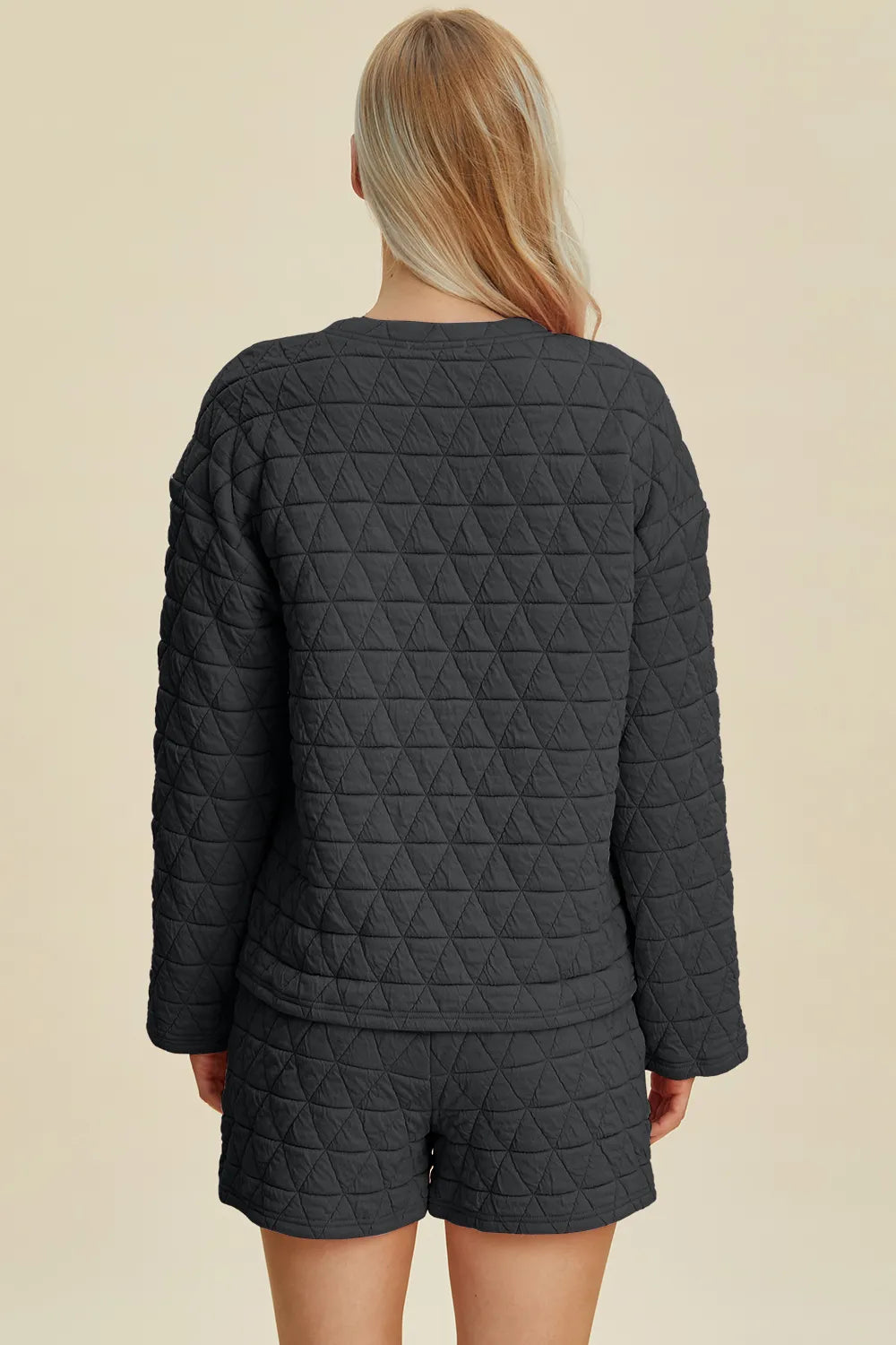 Black quilted long-sleeve round-neck top and matching shorts set