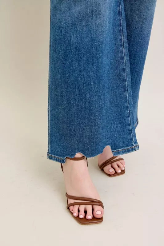 Destroyed hem detail on high-waist wide-leg jeans with split front edge