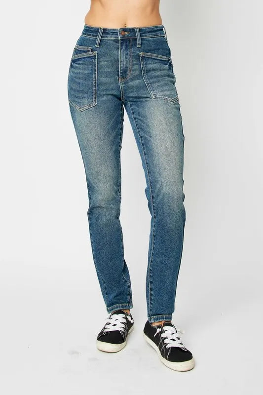 Dark high-waist skinny jeans—front patch pockets, button closure, belt loops