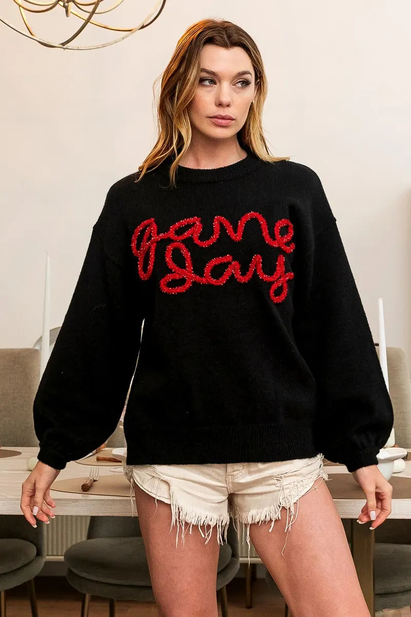 Black pullover with red “Game Day” lettering, ribbed hem and long sleeves