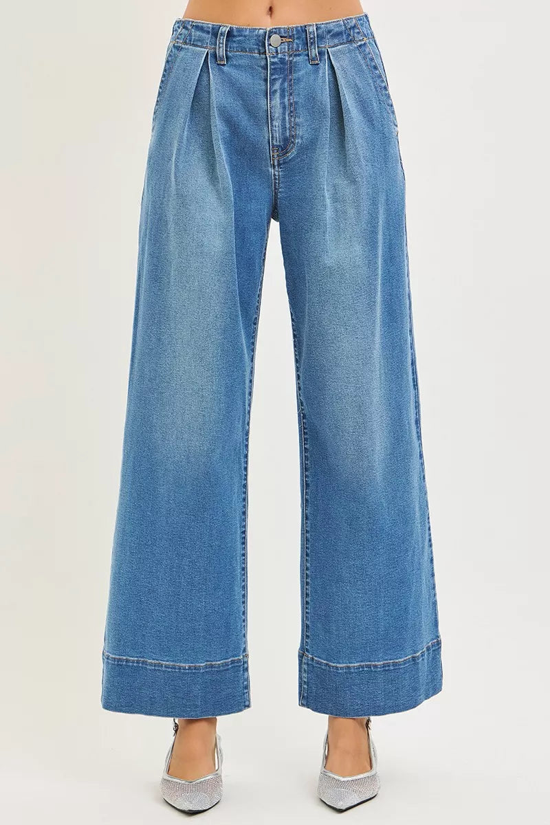 Medium-wash wide-leg jeans with center seam and pleated waistband