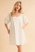 White square-neck babydoll dress with puff sleeves and gathered waist