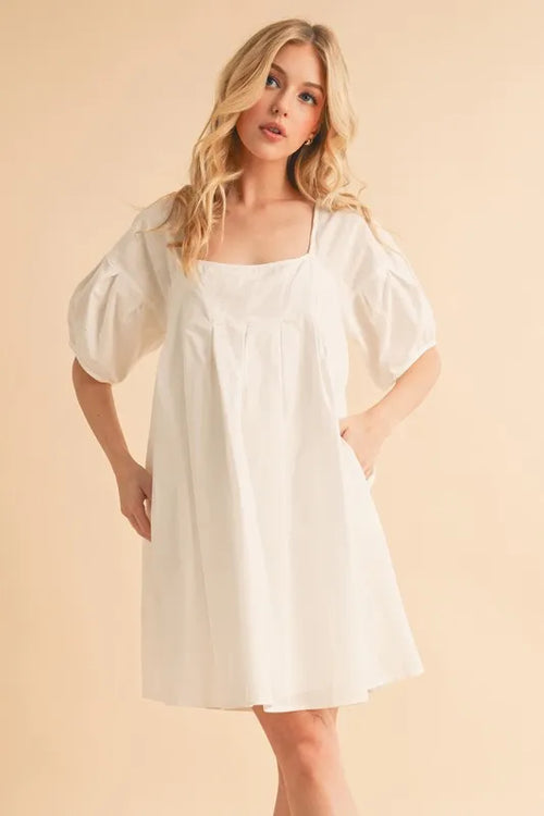White square-neck babydoll dress with puff sleeves and gathered waist