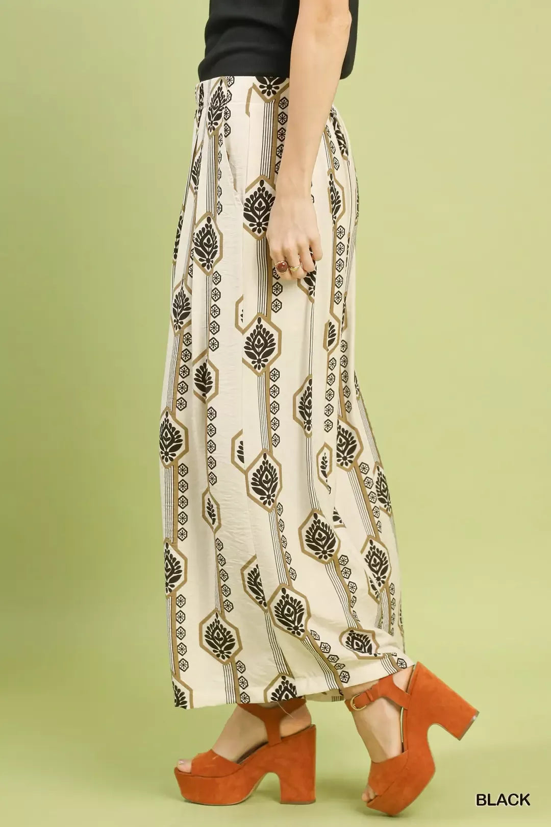 Cream wide-leg boho pants with vertical black motifs, relaxed fit and ankle-length hem