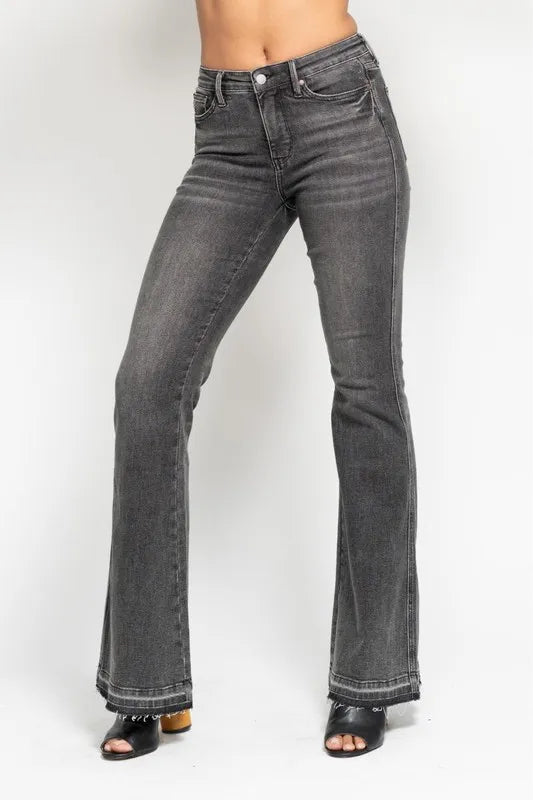 Washed gray mid-rise flare jeans with frayed hem and button-and-zip front
