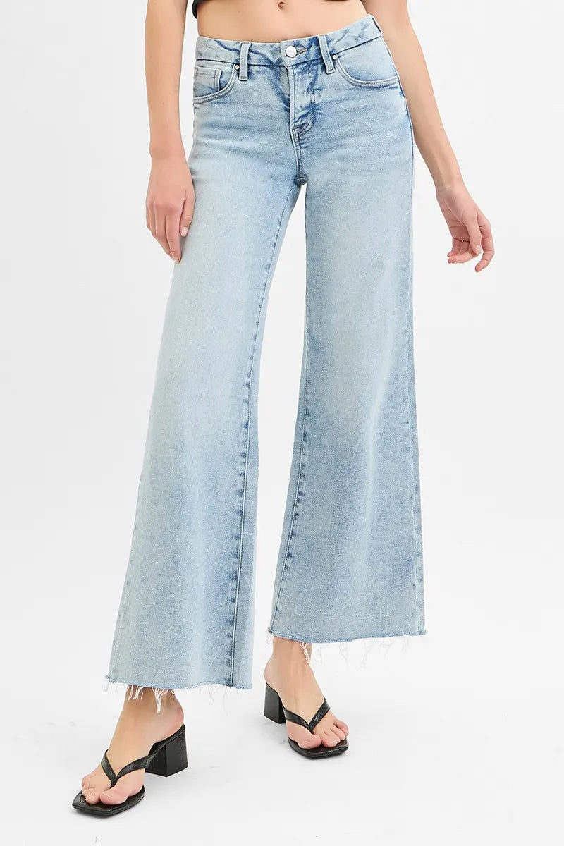 Light-wash wide-leg jeans, low rise, raw-cut hem with frayed edge