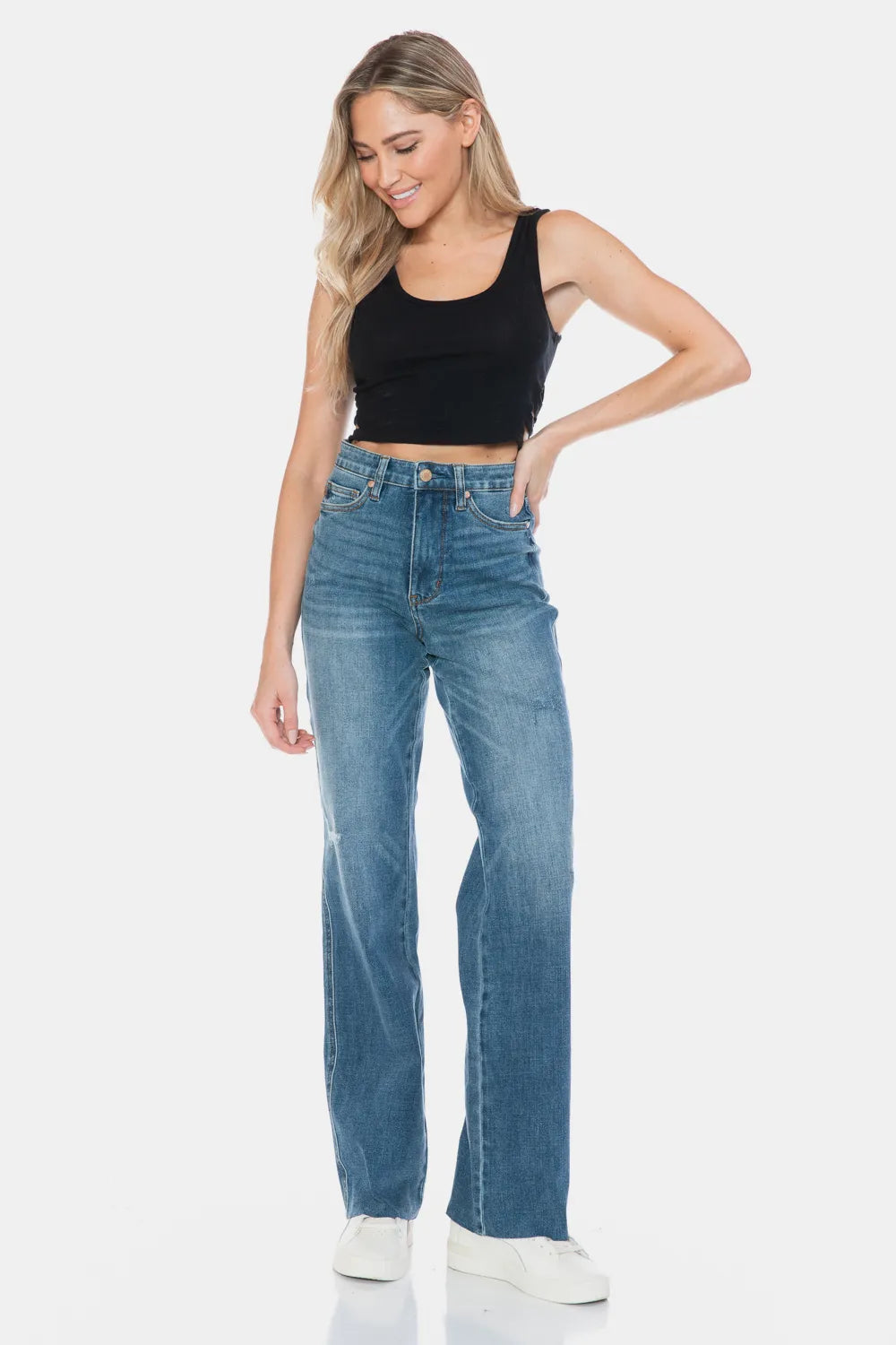Medium-wash straight jeans with raw cuff hem, front pockets and zip fly