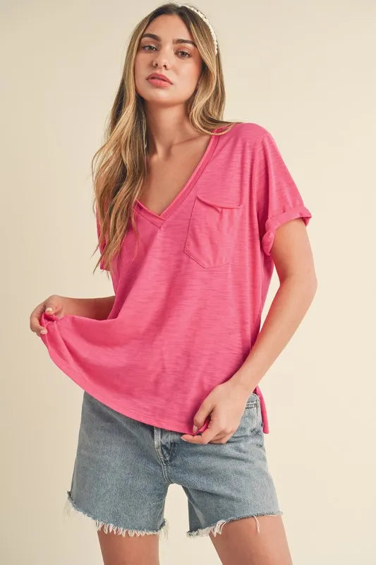 Hot pink V-neck short-sleeve T-shirt with rolled cuffs, pocket, side slit hem