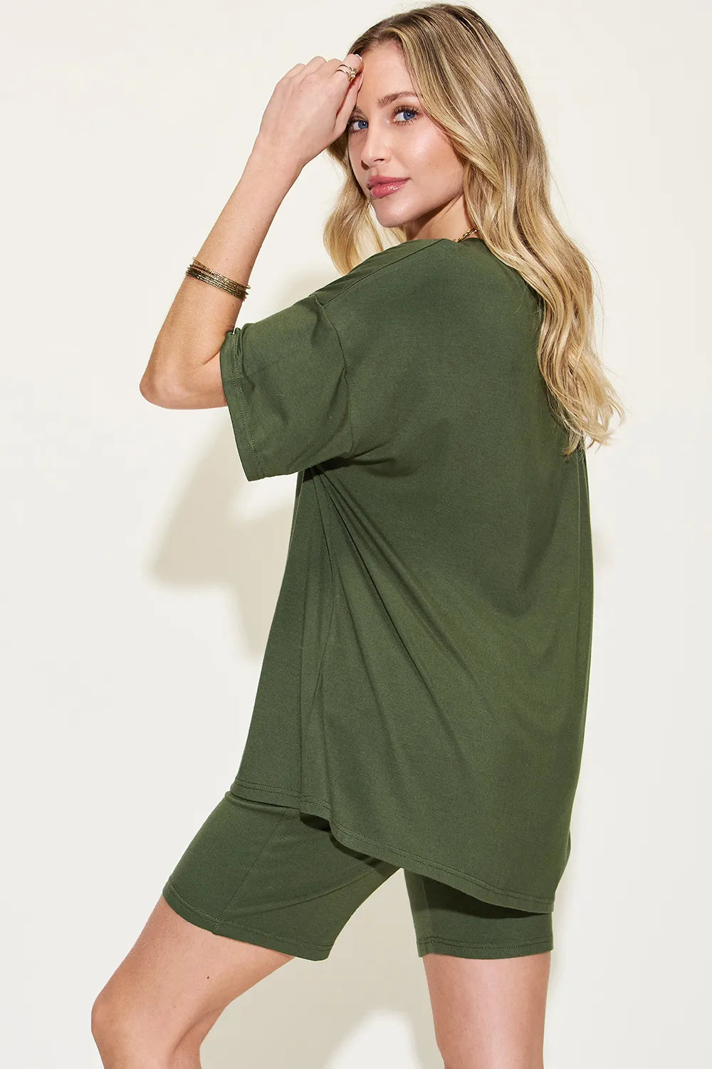 Dark green V-neck T-shirt with extended back hem and matching shorts