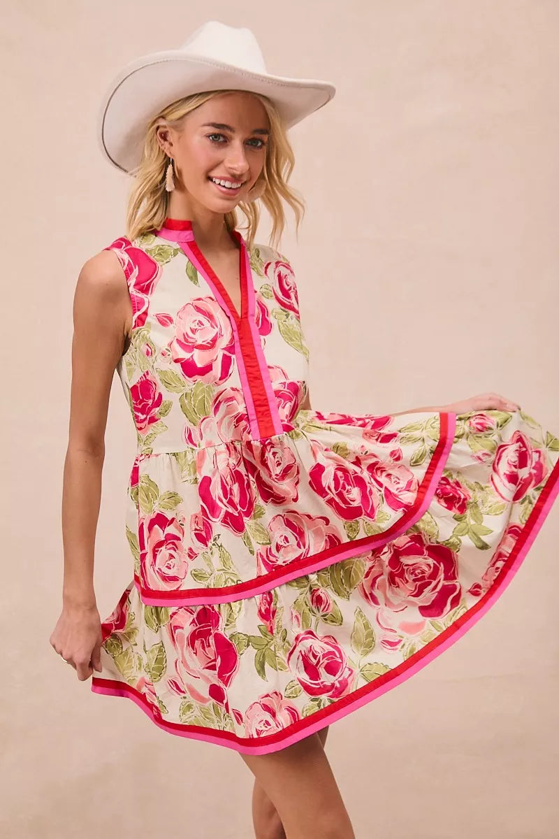 Floral woven mini dress with pink-trimmed V-neck and layered tiered ruffles